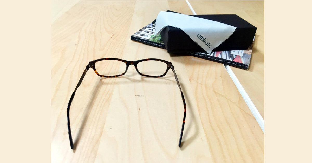 Tortoise prescription glasses began from Umizato sitting on a flat surface