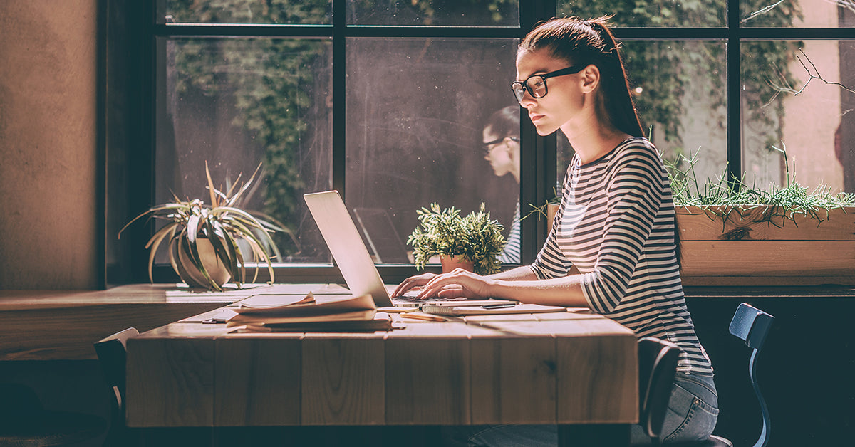 women on computer wearing glasses